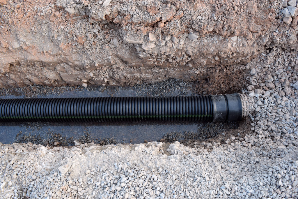 Buried Sewer Line in Road Construction Watermain Tubing Piping Water Infastructure Plumbing